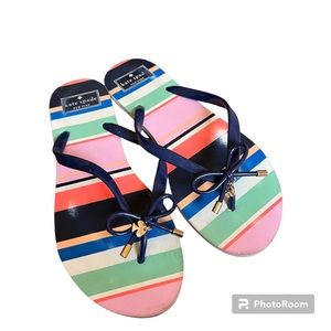 🩴KATE SPADE: Women’s size 9-10, multicolor striped flip-flops w/bow design.